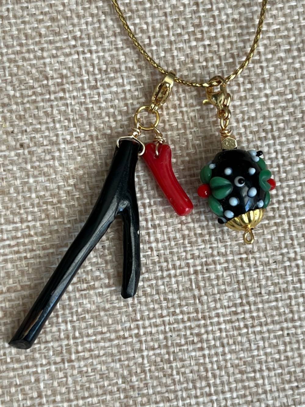 Two Charms. Black and red Corals, & Floral Glass Bead